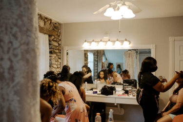 Makeup artists in dressing room